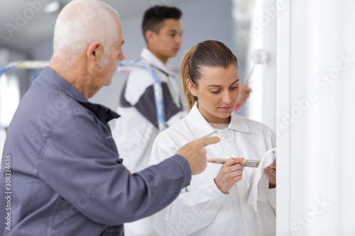 female apprentice decorator in training