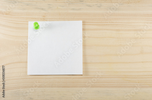 white sheet of paper pinned to a wooden wall, mock up, copy space
