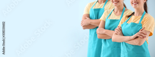 Team of janitors on color b...