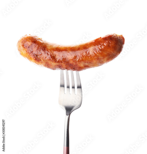 Fork with grilled sausage on white background