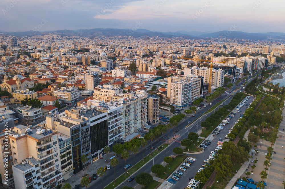 Fototapeta premium Limassol, Republic of Cyprus, aerial cityscape. Many buildings of resort town, drone photo.