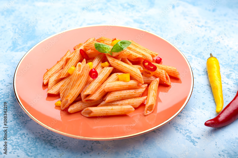 Plate with tasty pasta on color background Plate with tasty pasta on color background