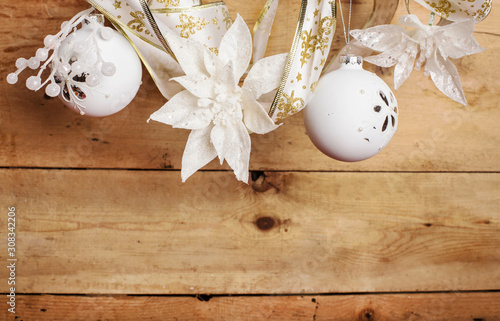 white christmas decorations over wooden background