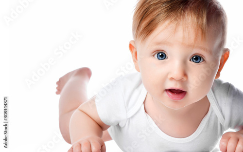 Fotografie Infant child baby boy kid with blue eyes happy smiling screaming lying on a floo