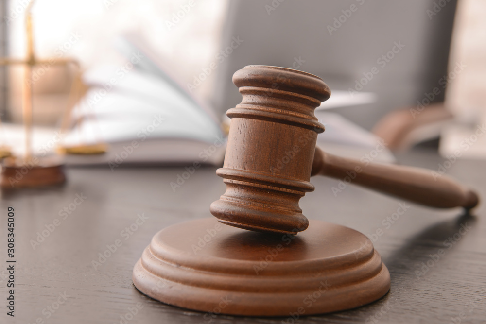 Judge's gavel on table in office Judge's gavel on table in office