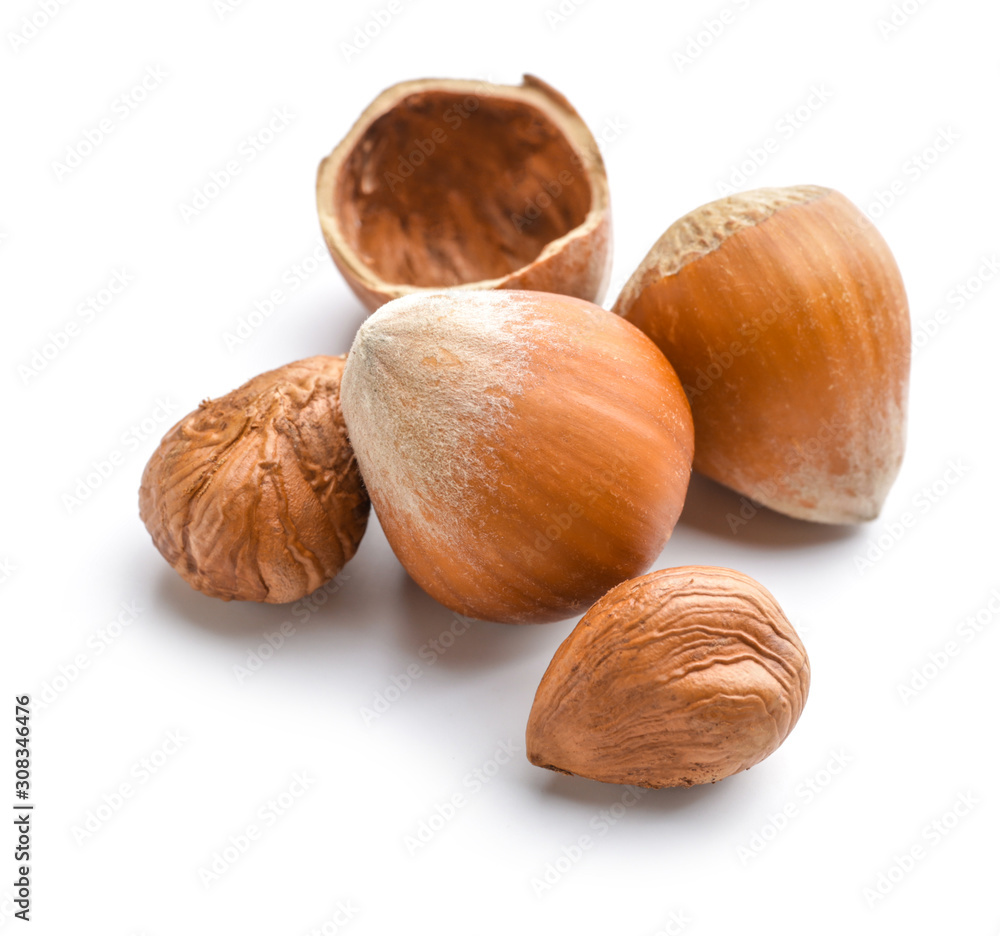 Tasty hazelnuts on white background Tasty hazelnuts on white background