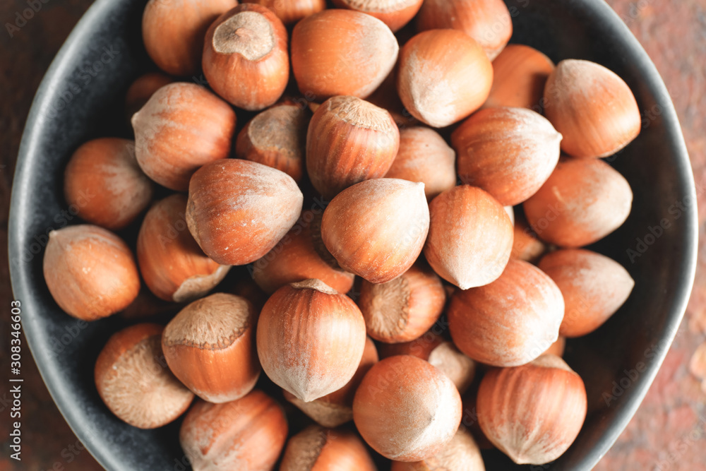 Plate with tasty hazelnuts, top view Plate with tasty hazelnuts, top view