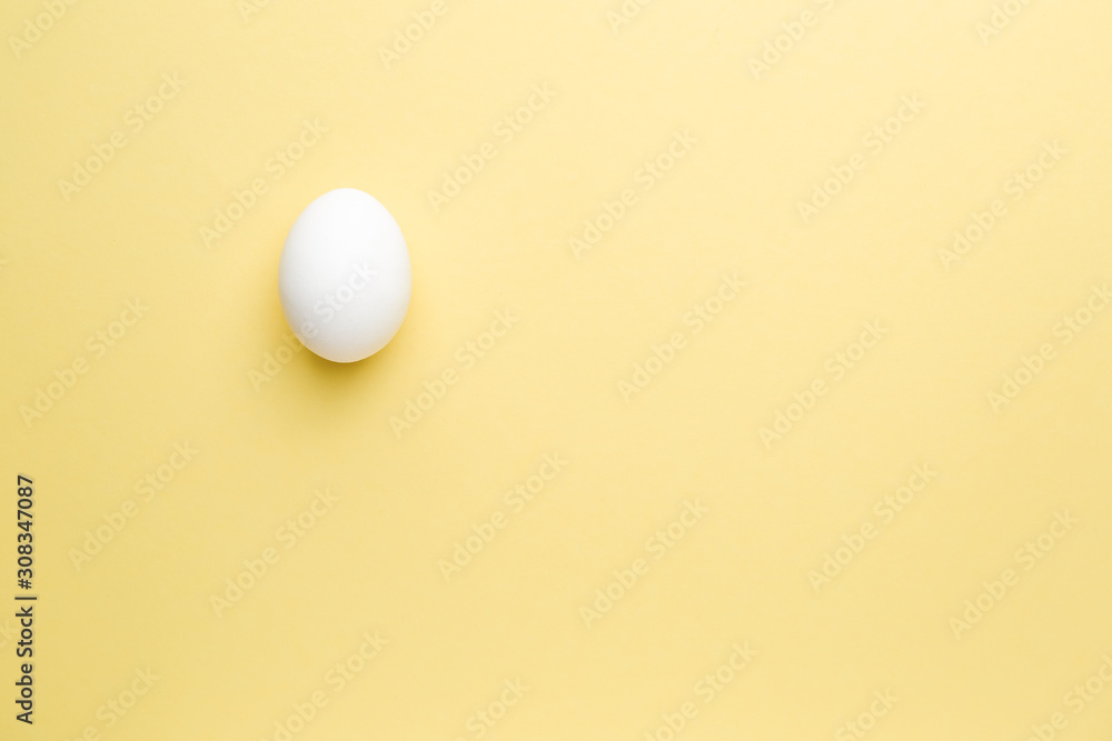 Fresh raw egg on color background Fresh raw egg on color background