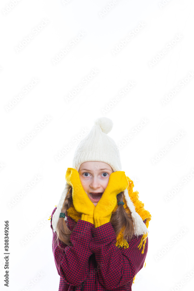 Winter Kids Concepts. Portrait of Surprised and Exclaiming Caucasian Girl Posing in Winter Outfit With Pigtails Against White in Studio.
