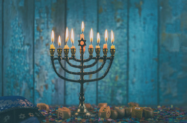 Closeup of a burning Chanukah candlestick with candles Menorah