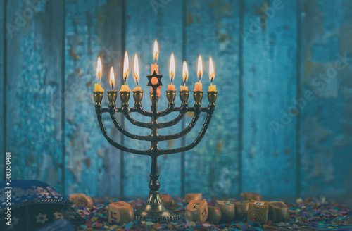 Closeup of a burning Chanukah candlestick with candles Menorah photo