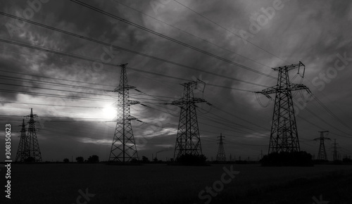 Schilderij op canvas high-voltage  power lines at sunset.