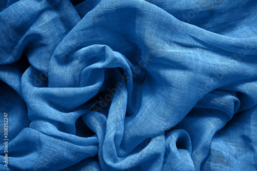 Blue cotton fabric background. Color of the year 2020 classic blue toned. photo
