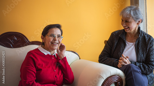 Old ladies talking on the couch
