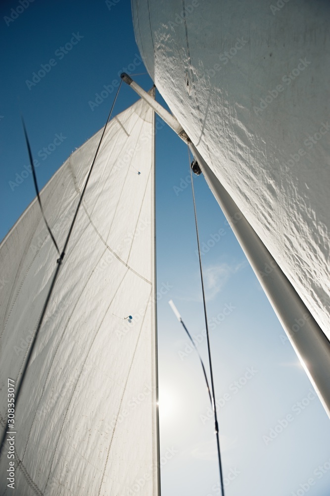 Fototapeta premium Sail of a sailing boat against the sky