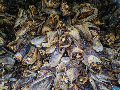 Heads of dried fish are piled