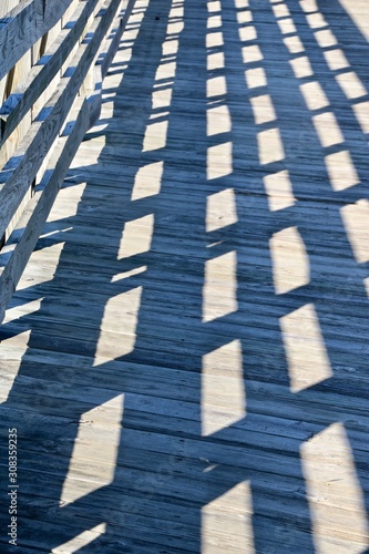 Shadow on wooden bridge