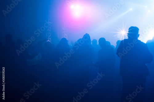 abstrac defocus images people are at a party with colorful lights