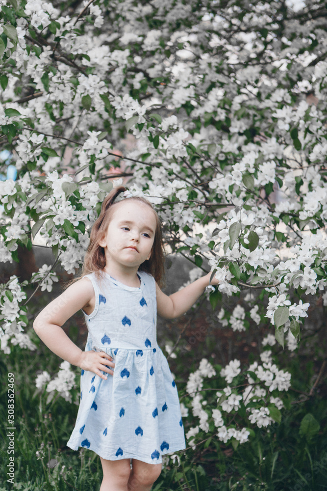 beautiful girl holding flowers. March 8: woman among flowers. the concept of congratulations, women's holidays, natural make up