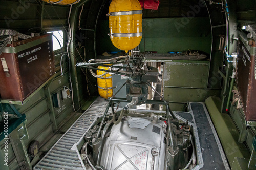 B-24 Liberator interior view of Ball Turret mount with yellow oxygen tanks and ammo cans. photo