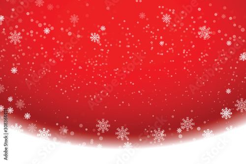 Snowflakes and snowfall on a cold red winter background.