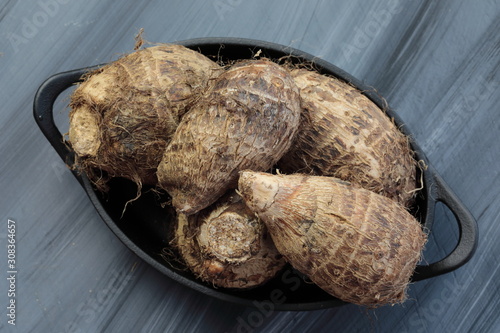 A conatiner with Taro roots or Colocasia or yams photo