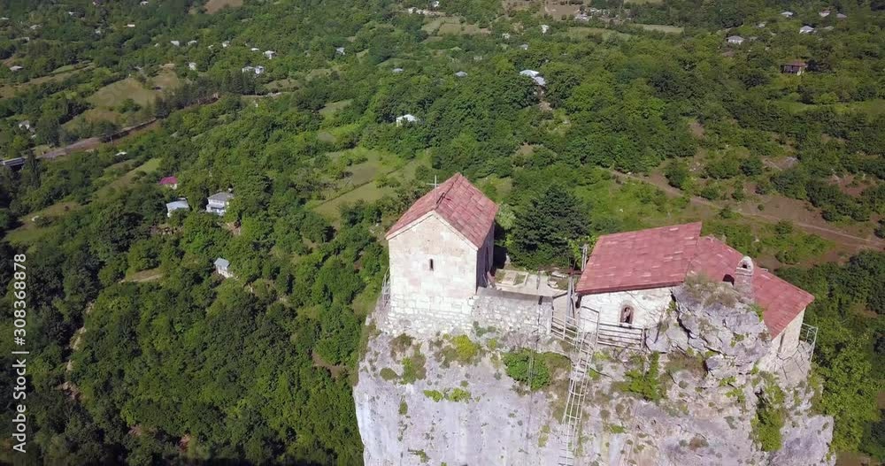 Flying at the Katskhi Pillar and the monestery in Georgia by drone on a sunny day. Flying at the Katskhi Pillar and the monestery in Georgia by drone on a sunny day.