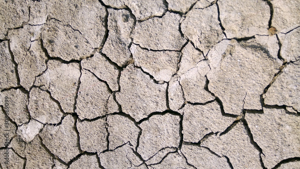 Land with dry and cracked ground. Land with dry and cracked ground.