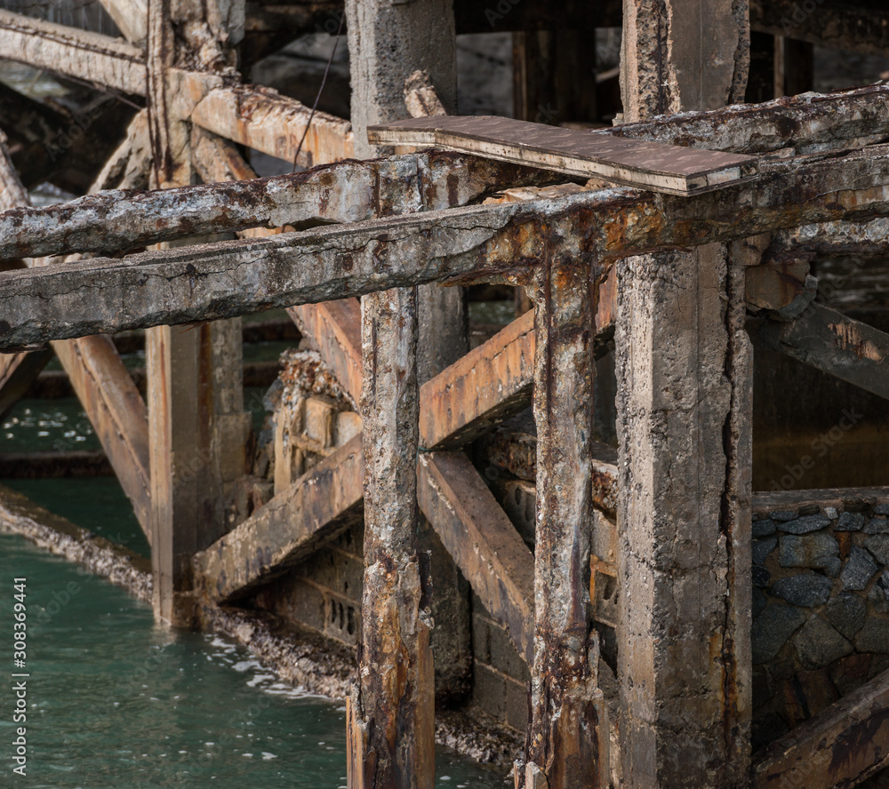 Reinforced concrete have cracked and rusty in steel structure in caused by salt in the sea Reinforced concrete have cracked and rusty in steel structure in caused by salt in the sea