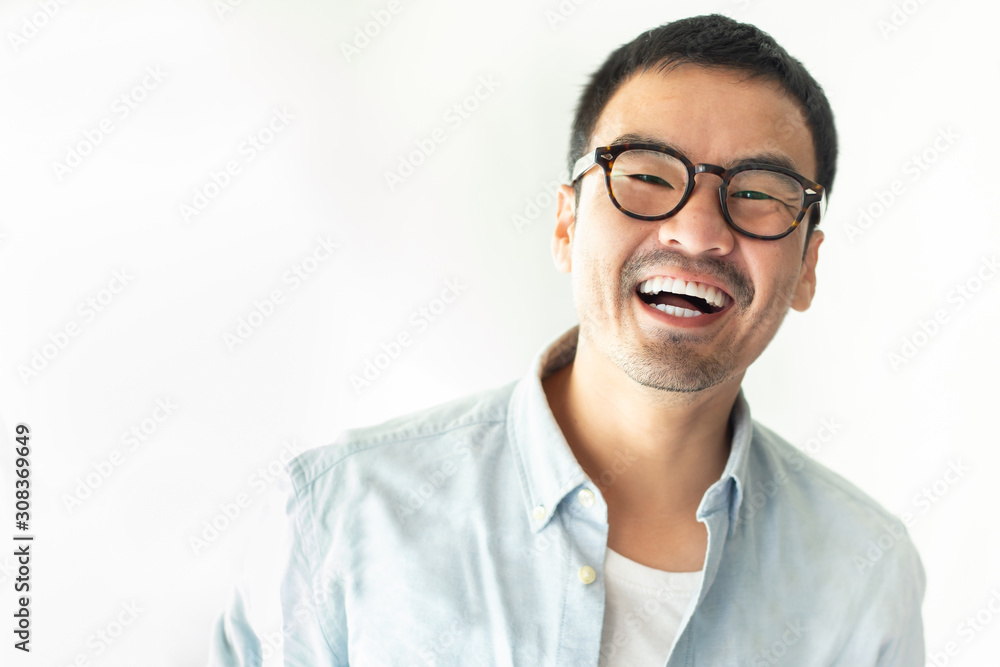 portrait happy cheerful young asian man with perfect smilling,clean skin.posing show white teeth smile relaxing on white bacjground.fashion people freedom life style concept portrait happy cheerful young asian man with perfect smilling,clean skin.posing show white teeth smile relaxing on white bacjground.fashion people freedom life style concept