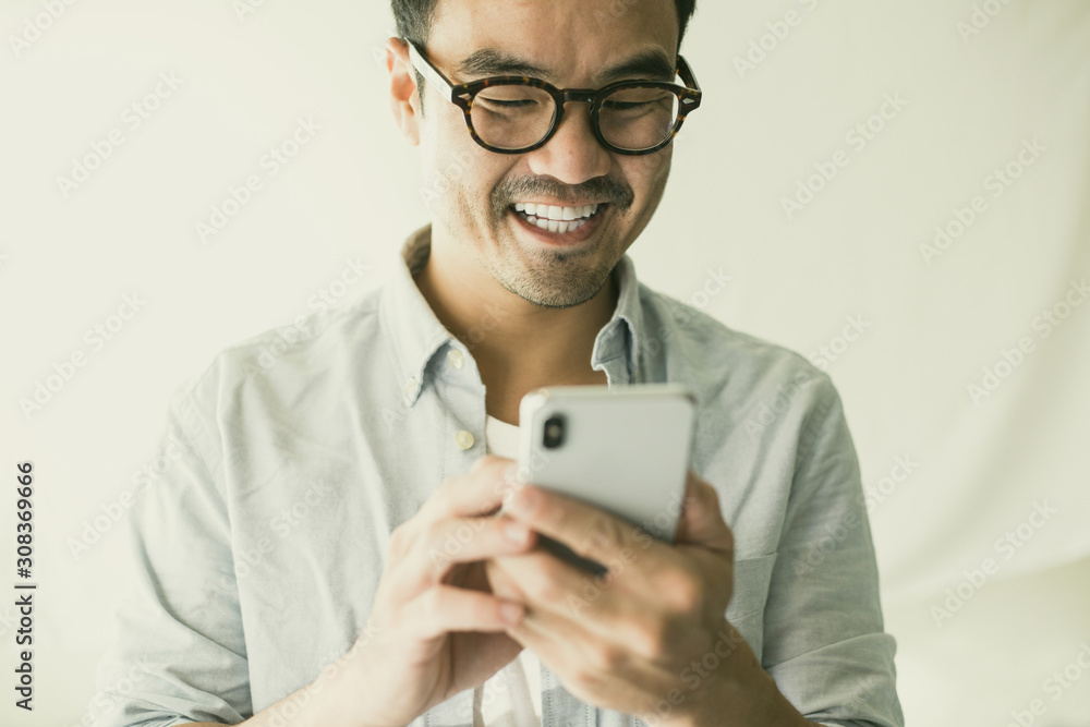 asian man using cell phone.hand holding texting message on screen mobile chatting friend,search internet information.technology device contact communication connecting people concept