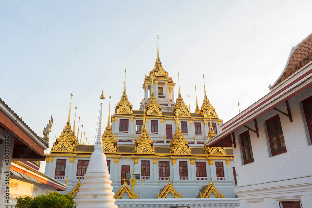 Fototapeta premium Loha Prasat, The metallic castle covered with gold leaf of Wat Ratchanadda Temple in Bangkok, Thailand.