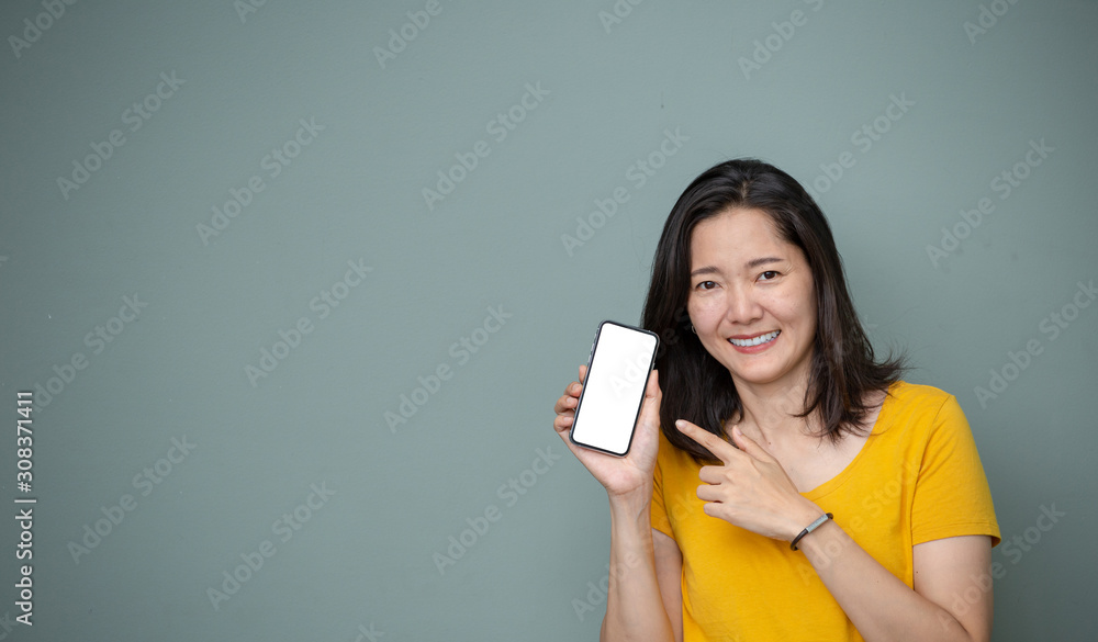 Mockup image blank white screen cell phone.woman holding texting using mobile on background space for text.background empty space for advertise text.people contact marketing business and technology 