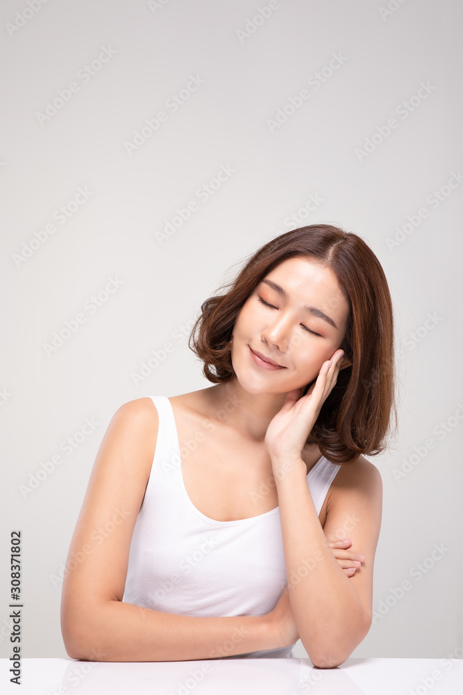 Beautiful Asian young woman close her eyes touching soft cheek smile with clean and fresh skin Happiness and cheerful with positive emotional,isolated on white background,Beauty and Cosmetics Concept Beautiful Asian young woman close her eyes touching soft cheek smile with clean and fresh skin Happiness and cheerful with positive emotional,isolated on white background,Beauty and Cosmetics Concept