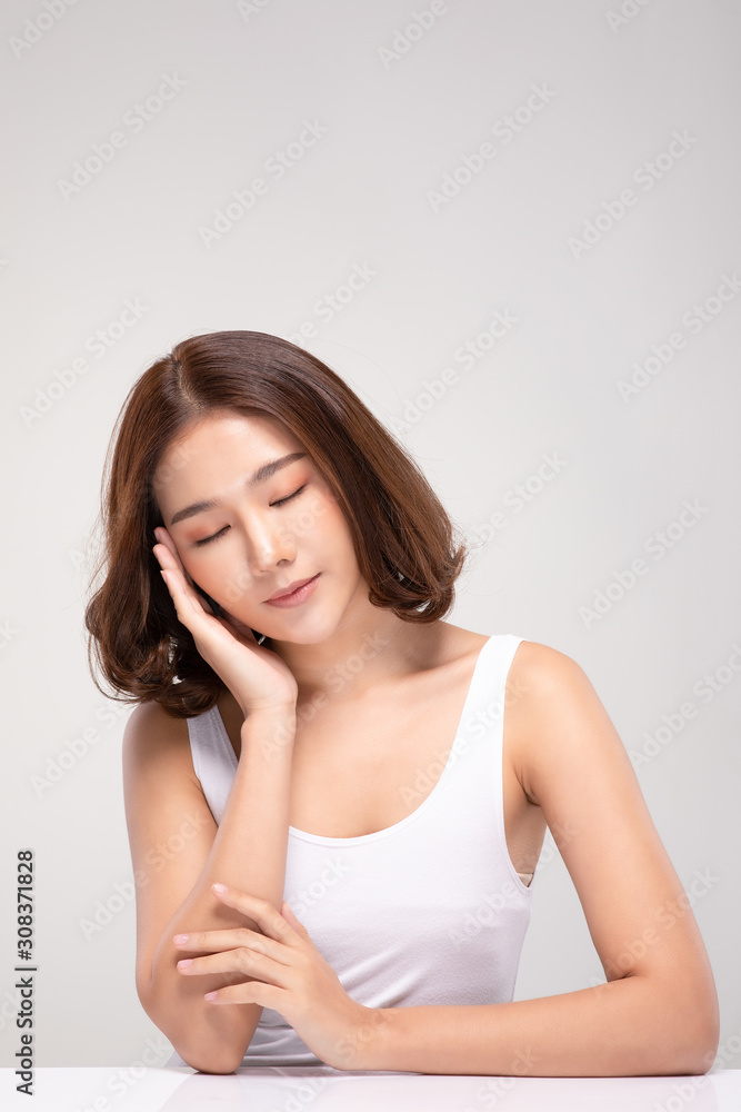 Beautiful Asian young woman close her eyes touching soft cheek smile with clean and fresh skin Happiness and cheerful with positive emotional,isolated on white background,Beauty and Cosmetics Concept Beautiful Asian young woman close her eyes touching soft cheek smile with clean and fresh skin Happiness and cheerful with positive emotional,isolated on white background,Beauty and Cosmetics Concept