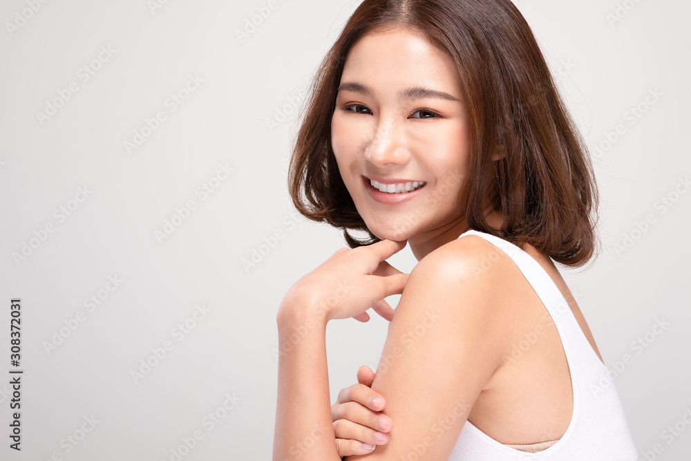 Beautiful Young Asian Woman with short hair Looking While Touching Chin feeling so happy and cheerful with healthy Clean and Fresh skin,isolated on white background,Beauty Cosmetics Concept Beautiful Young Asian Woman with short hair Looking While Touching Chin feeling so happy and cheerful with healthy Clean and Fresh skin,isolated on white background,Beauty Cosmetics Concept