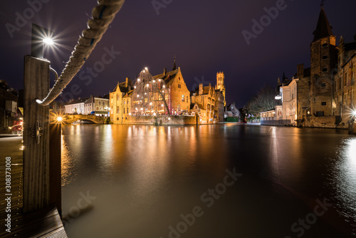 Perez de Malvenda house and Belfry of Bruges during the Christmas period photo