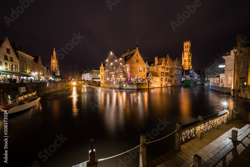 Perez de Malvenda house and Belfry of Bruges during the Christmas period photo