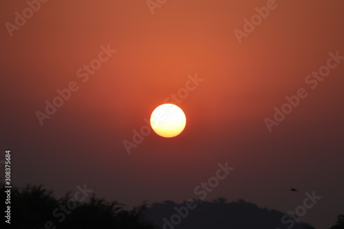 Sun, sunset, sunrise. Colorful toned instant photo,big sunrise.Panoramic view of the sunrise in the mountains © Dinesh