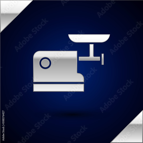 Silver Kitchen meat grinder icon isolated on dark blue background. Vector Illustration
