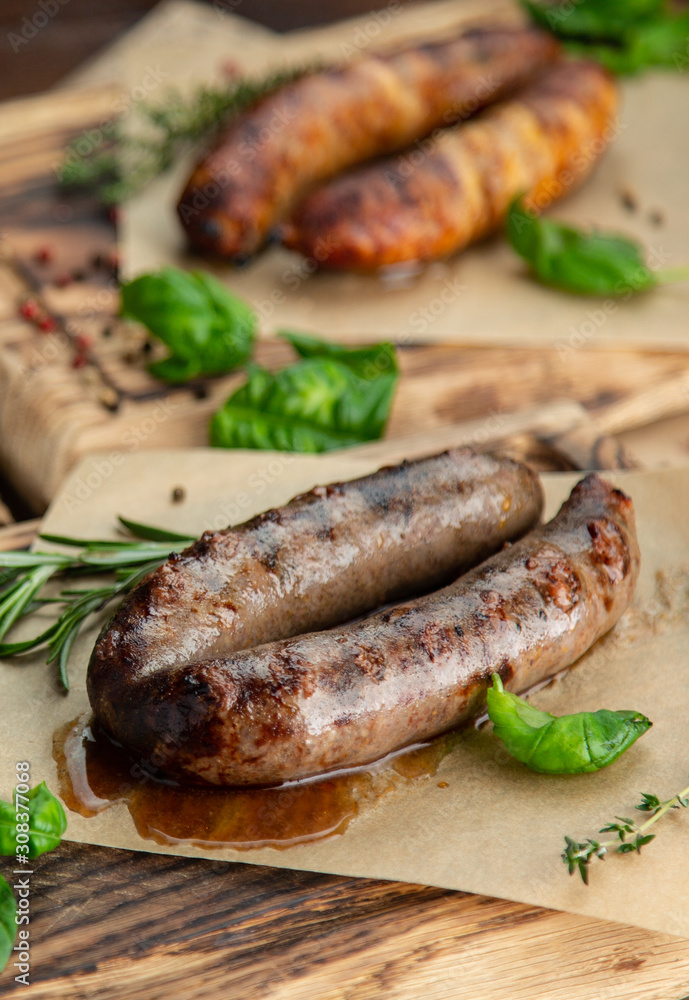 sausages on grill with vegetables