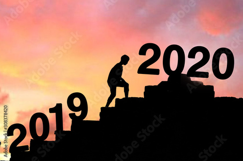 Silhouette boy walking Happy New Year 2020