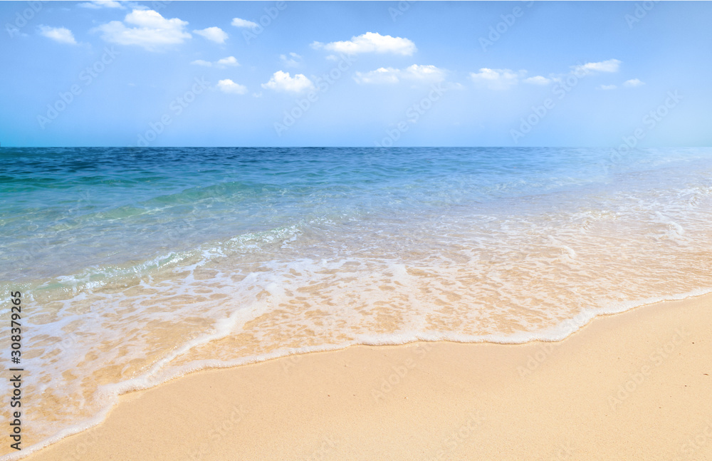 Tropical white sand beach and soft calm sea waves