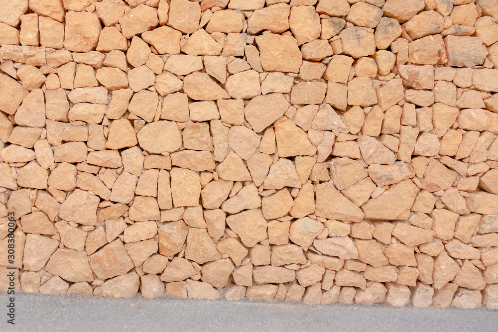 Masonry wall of stones with irregular pattern texture background Masonry wall of stones with irregular pattern texture background