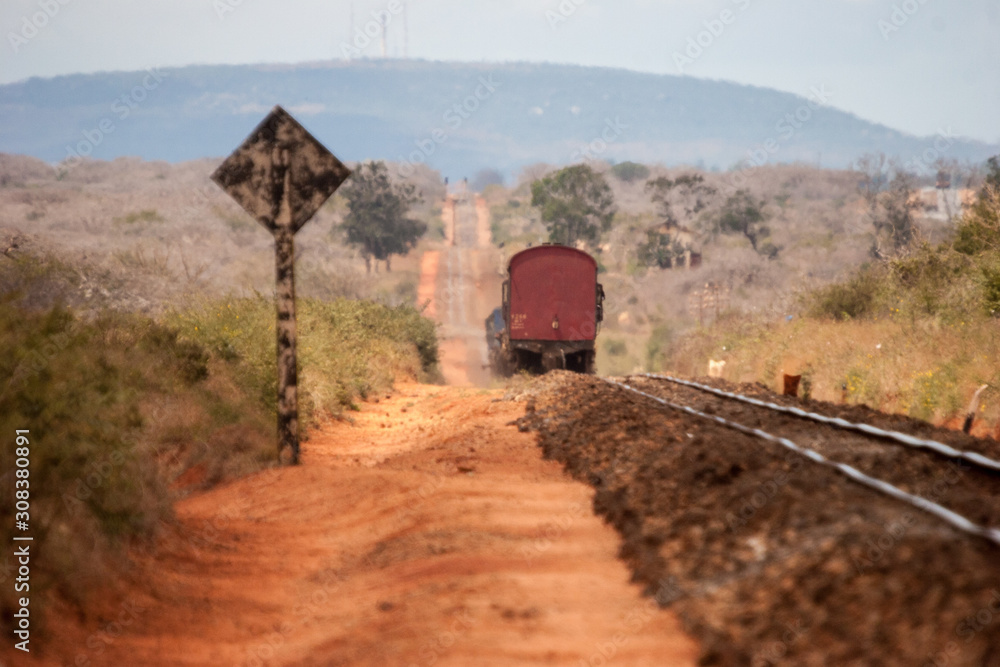 Train along railway line between Nairobi and Mombasa, old train before modernization by Chinese Train along railway line between Nairobi and Mombasa, old train before modernization by Chinese