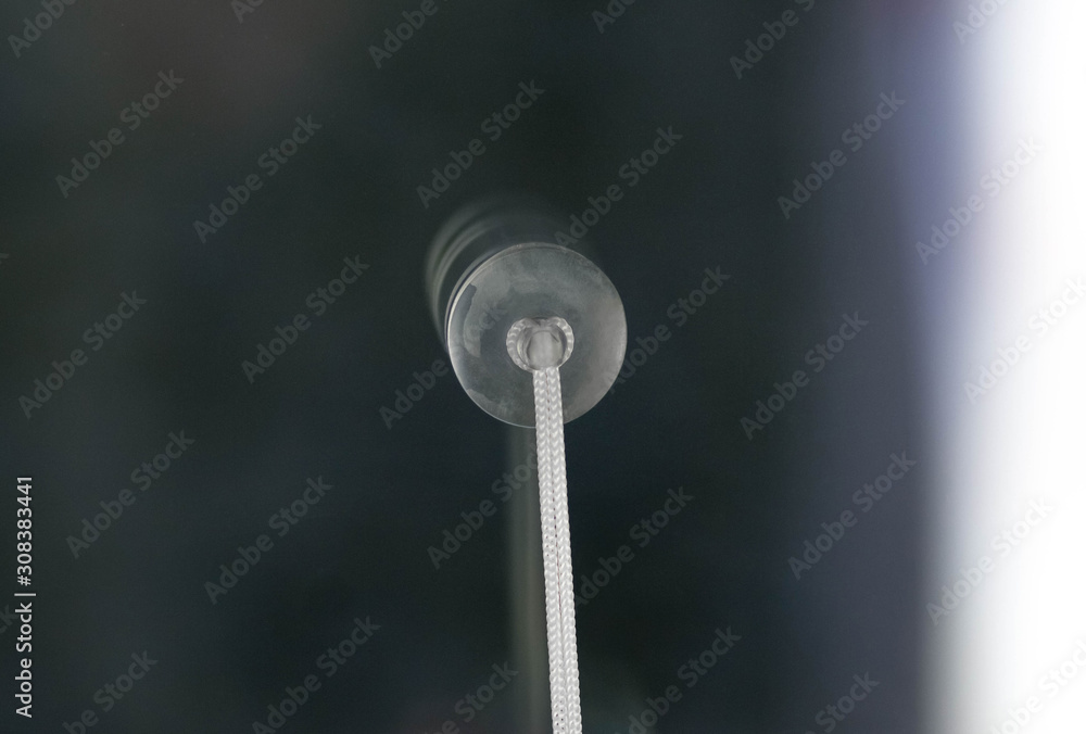The suction Cup is glued to the glass. Close up The suction Cup is glued to the glass. Close up