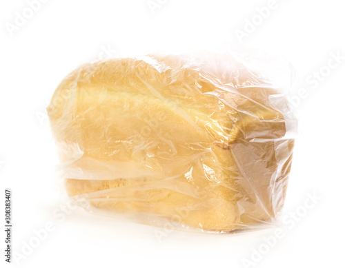 A loaf of fresh bread in a bag. Close up. Isolated on white background