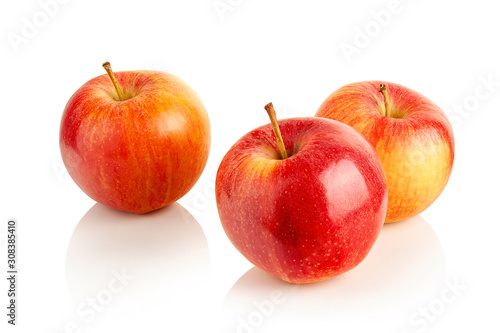 three ripe red apples