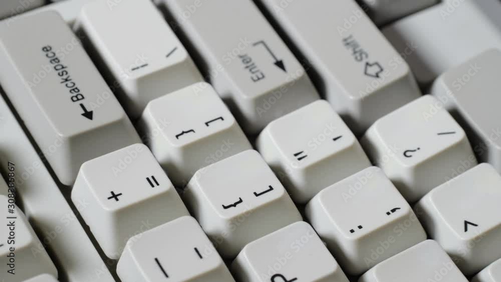 Finger presses equal or plus button on keyboard Finger presses equal or plus button on keyboard