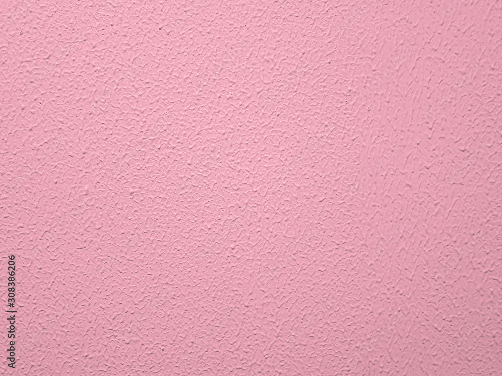 Fototapeta premium Pink textured wall painted pink